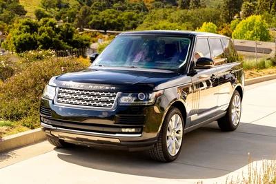 The 2014 Range Rover Supercharged in dark studio lighting