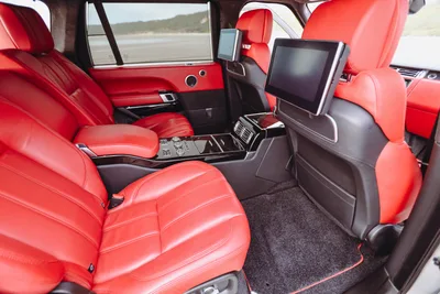 Rear cabin of the LWB in pimento leather, with entertainment screens in the headrests